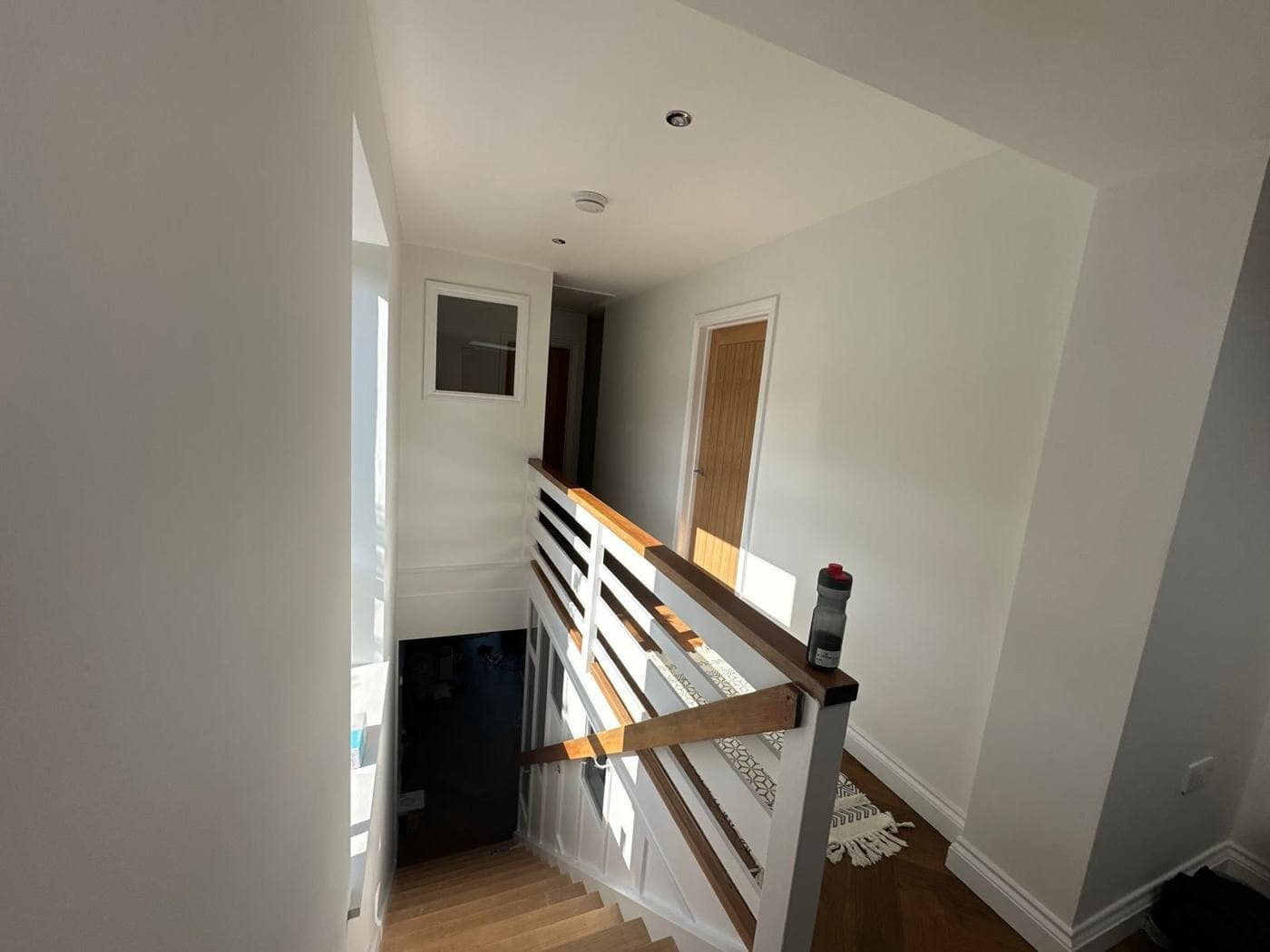 Staircase with oak handrail and glass balustrade — rcbGroup project